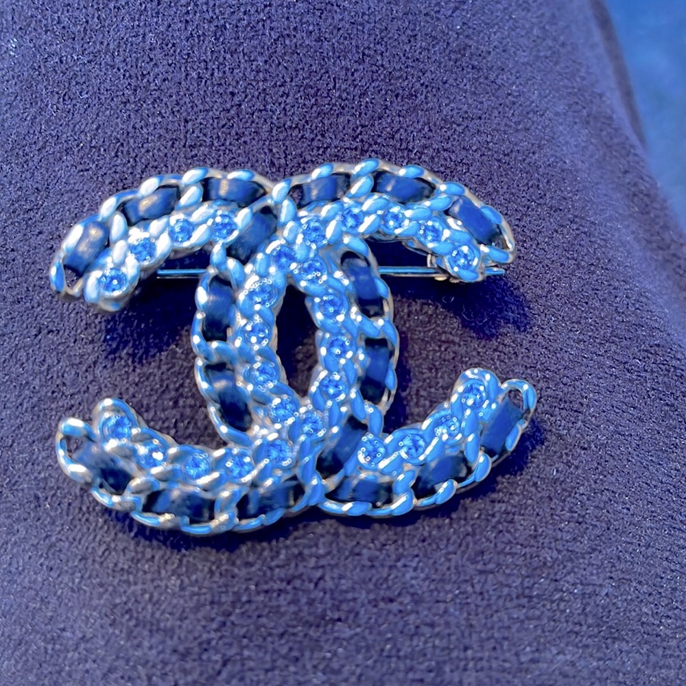 Chanel costume brooch.  Metal black threading.Costume C. Clasp. Great for suits.